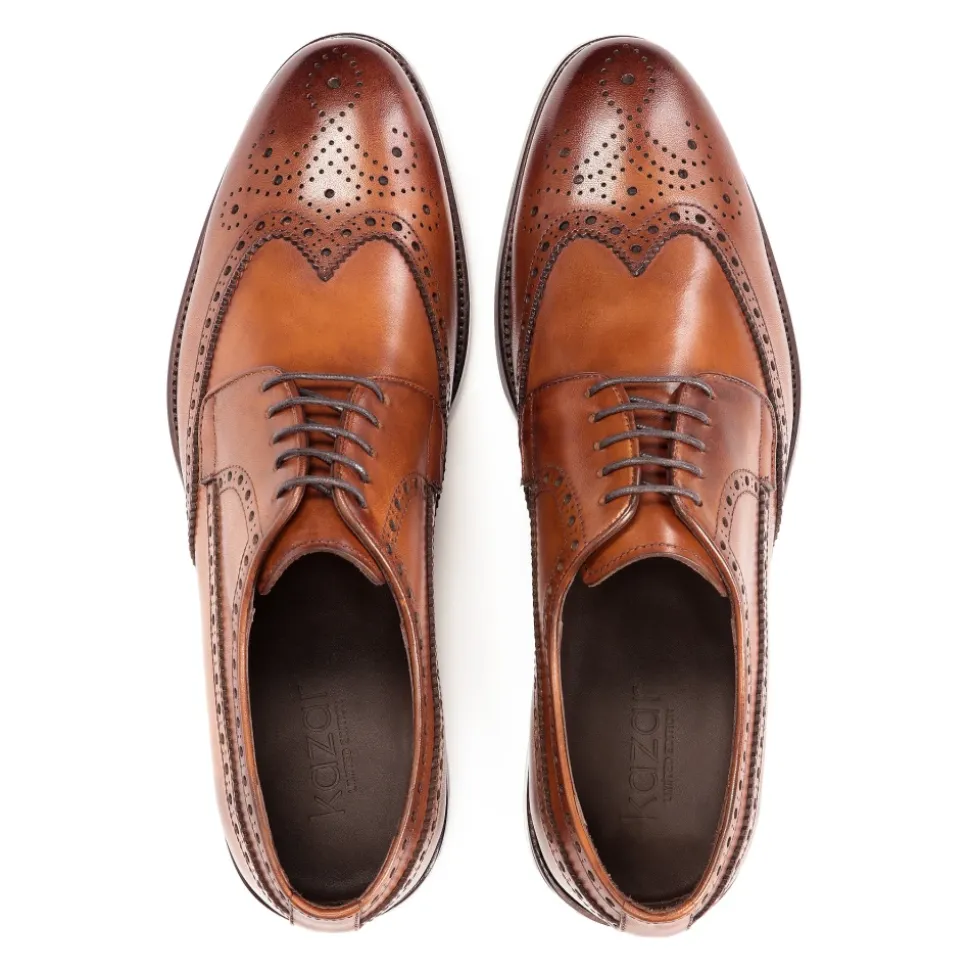 Klassieke bruine brogues met een rozetdecoratie