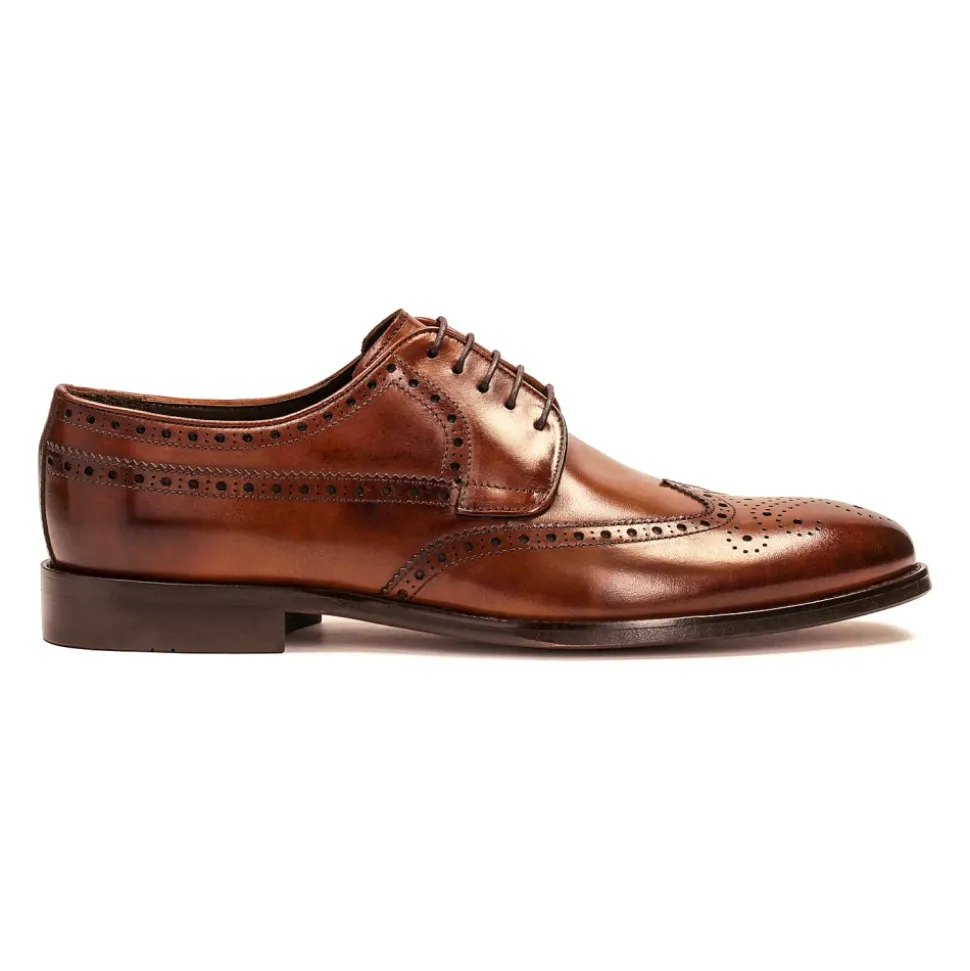 Klassieke bruine brogues met een rozetdecoratie